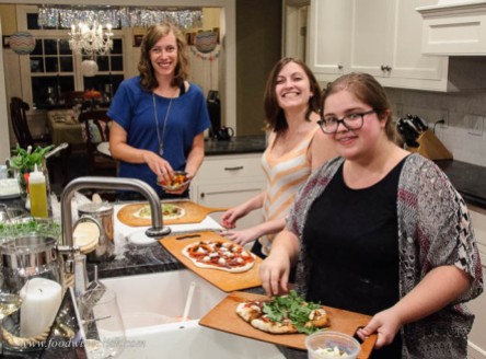 Casey (in blue) with her fellow pizza artists, Devon and Emily