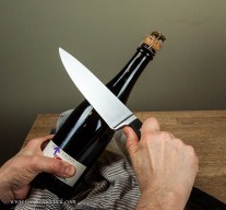 Practice by slowly sliding the knife along the bottle seam. One, two, on three you go!