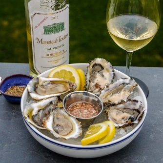 Raw oyster plate with Bordeaux Blanc