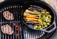 Consolidate the veggies on the indirect side when it's time to cook the steaks