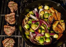 Grilled dinner, as requested. Lamb chops, potato wedges, brussels sprouts and red onions.